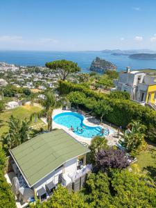an aerial view of a resort with a swimming pool at La Capannina - Hotel & Apartments in Ischia Town