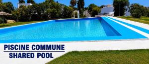 a swimming pool in front of a villa at Villa Jasmin 15 in M'diq