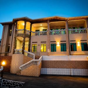 a large building with stairs in front of it at Kivu Go-Lax Resort in Gisenyi