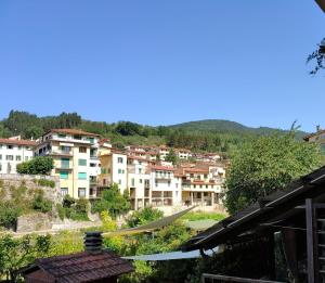a view of a city with a hammock at Albizi Home in Pontassieve