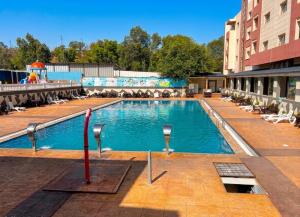 a large swimming pool on the side of a building at Morjan apart in Tangier