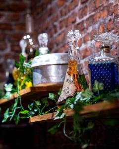 a bottle of alcohol sitting on a table at La Suite Magique du Sorcier in Nîmes +23 photos