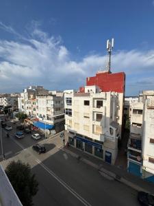 an aerial view of a city with buildings and a street at Appartement à Miramar in Martil