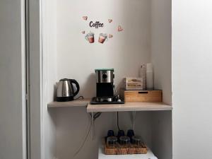 a shelf with coffee cups on a wall at Tenuta Moffa in Tramonti