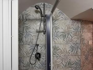 a shower stall in a bathroom with a wall at Tenuta Moffa in Tramonti +28 photos