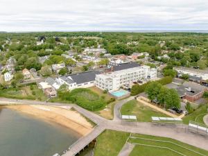 an aerial view of a town next to the water at The Harbor Front Inn in Greenport