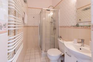 a bathroom with a shower and a toilet and a sink at Rezydencja Arabeska in Lądek-Zdrój +48 photos