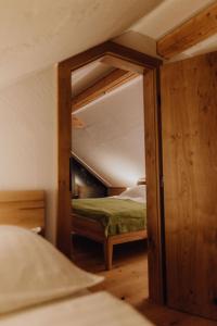 a bedroom with a bunk bed in a room at Chalet im Obstgarten in Lengau