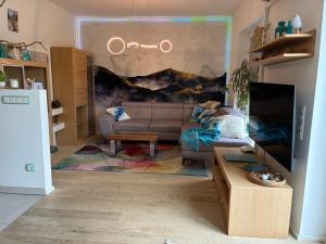 a living room with a couch and a table at Haus Güldengossa in Großpösna +18 photos