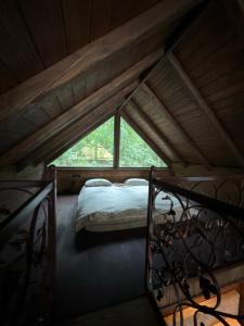 a bedroom with a bed in a attic at Royal Ranch Nature Resort in Orhei