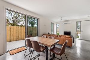 a living room with a table and a couch at The Cape Collective 6 in Margaret River Town