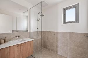 a bathroom with a sink and a shower at The Cape Collective 6 in Margaret River Town +11 photos