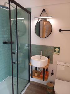 a bathroom with a sink and a mirror at Quinta Pedra do Rio - Tâmega in Salvador do Monte