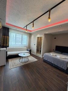 a bedroom with two beds and a table in it at KRAL GRAND OTEl in Istanbul +50 photos