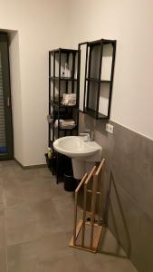 a bathroom with a sink and a mirror at Ferienwohnung Lindenglück in Uedem +16 photos