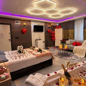 a large room with two beds and red balloons at KRAL GRAND OTEl in Istanbul