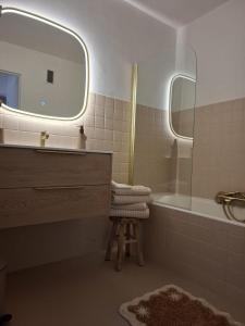 a bathroom with a sink and a mirror and a stool at Cannes à Pied in Cannes +49 photos