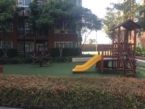 a playground with a slide and a play structure at Baan Tew Lom Cha-am (339/448) in Cha Am