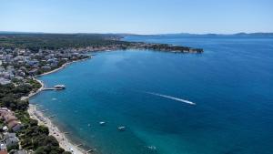 an aerial view of a beach with boats in the water at Apartments 2A in Petrcane