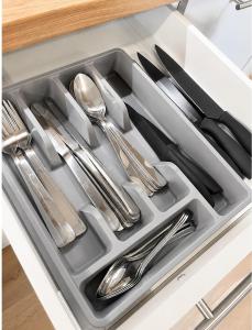 a tray of silver utensils in a kitchen drawer at Kaszmirowy Apartament in Wałcz
