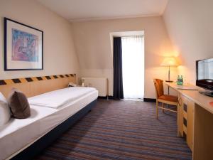 Voodi või voodid majutusasutuse ACHAT Hotel Dresden Elbufer toas
