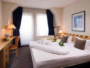 Voodi või voodid majutusasutuse ACHAT Hotel Dresden Elbufer toas