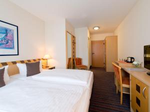 Voodi või voodid majutusasutuse ACHAT Hotel Dresden Elbufer toas