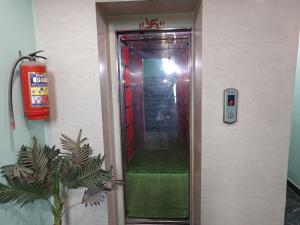 a elevator with a green staircase in a building at Hotel Jagdamba Residency in Chupra
