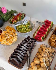 a table topped with lots of different types of food at La Luz Bozcaada in Bozcaada +53 photos