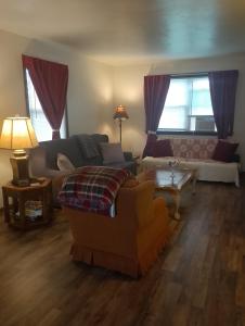 a living room with a couch and a table at Simple Stay in Youngstown