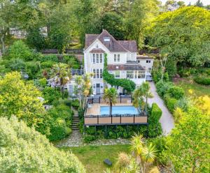 an aerial view of a house with a swimming pool at The Charterhouse in Torquay