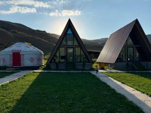two domes and a building with a dome at Miman house Kolsay in Kurmenty +36 photos