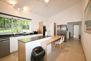 a kitchen with a counter and a kitchen island at Villa Philibert in Riambel