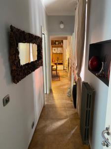 a hallway with a mirror on a wall at Casa Vacanza Pigna in Pigna