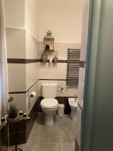 a bathroom with a toilet and a sink at Casa Vacanza Pigna in Pigna +84 photos