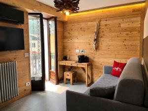 a living room with a couch and a table at Albergo Nazionale di Vernante in Vernante
