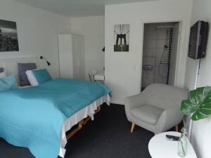 Postel nebo postele na pokoji v ubytování Hotel St. Binderup