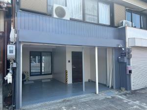 an entrance to a building with an open door at koharubi hanada in Murochō