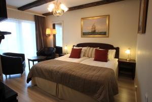 Postel nebo postele na pokoji v ubytování Vejby Strand Hotel