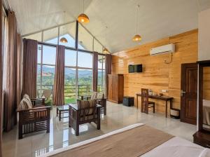 a bedroom with a bed and a table and chairs at Ella Dream Mount in Ella