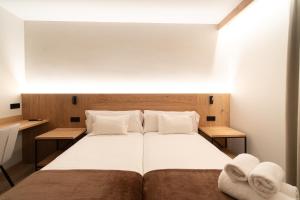 Llit o llits en una habitació de Hotel Bruna