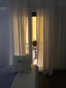 Postel nebo postele na pokoji v ubytování B&B Il Saraceno