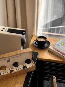 a bowl of coffee sitting on top of an oven at The 8 Hotel Budapest in Budapest