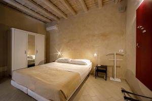 a bedroom with a large bed in a room at Secret B&B in Trapani