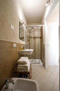 a bathroom with a sink and a shower at Secret B&B in Trapani +51 photos