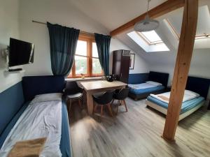 a bedroom with a bed and a desk and a table at WILLA HONO LULU in Busko-Zdrój +291 photos