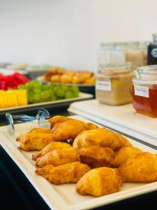 a plate of food on a table with food at Hotel Apoksiomen in Mali Lošinj +119 photos