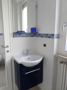 a bathroom with a sink and a mirror at VentoVerde B&B in Albenga +35 photos