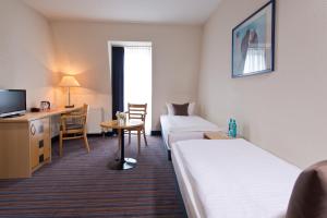 Voodi või voodid majutusasutuse ACHAT Hotel Dresden Elbufer toas