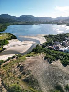 an aerial view of the shoreline of a beach at Vereda da Lagoa in Niterói